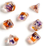 Sirius Dice 7 - Set Translucent Resin Purple, Orange, and Clear with White - Lost City Toys